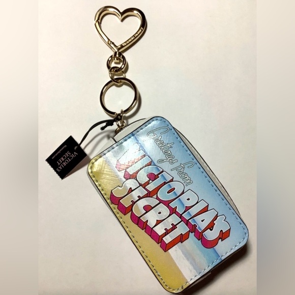Victoria's Secret 
•8" Postcard Keychain 
•Charm Coin
•Case Greetings From… - Picture 1 of 3
